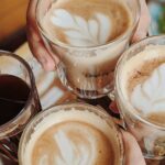 Enjoying delicious coffee with friends, perfect morning moment.